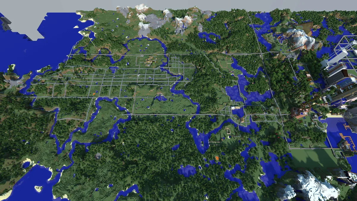 The Minecraft Realms city pushing toward the coast — new development extending the world outward to the water.